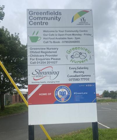 Meeting is located where this sign is.